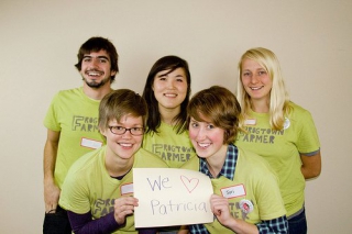 HECUA interns (Betsy and Siri holding sign) supporting Frogtown Farm