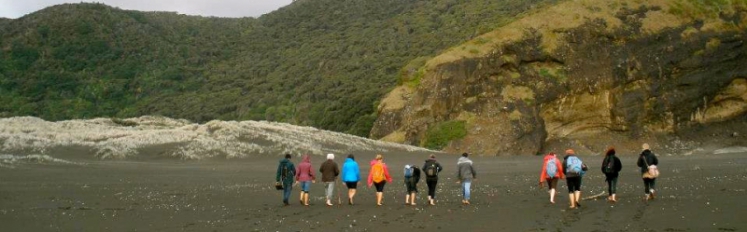 HECUA study abroad travels to a black sand beach in New Zealand.