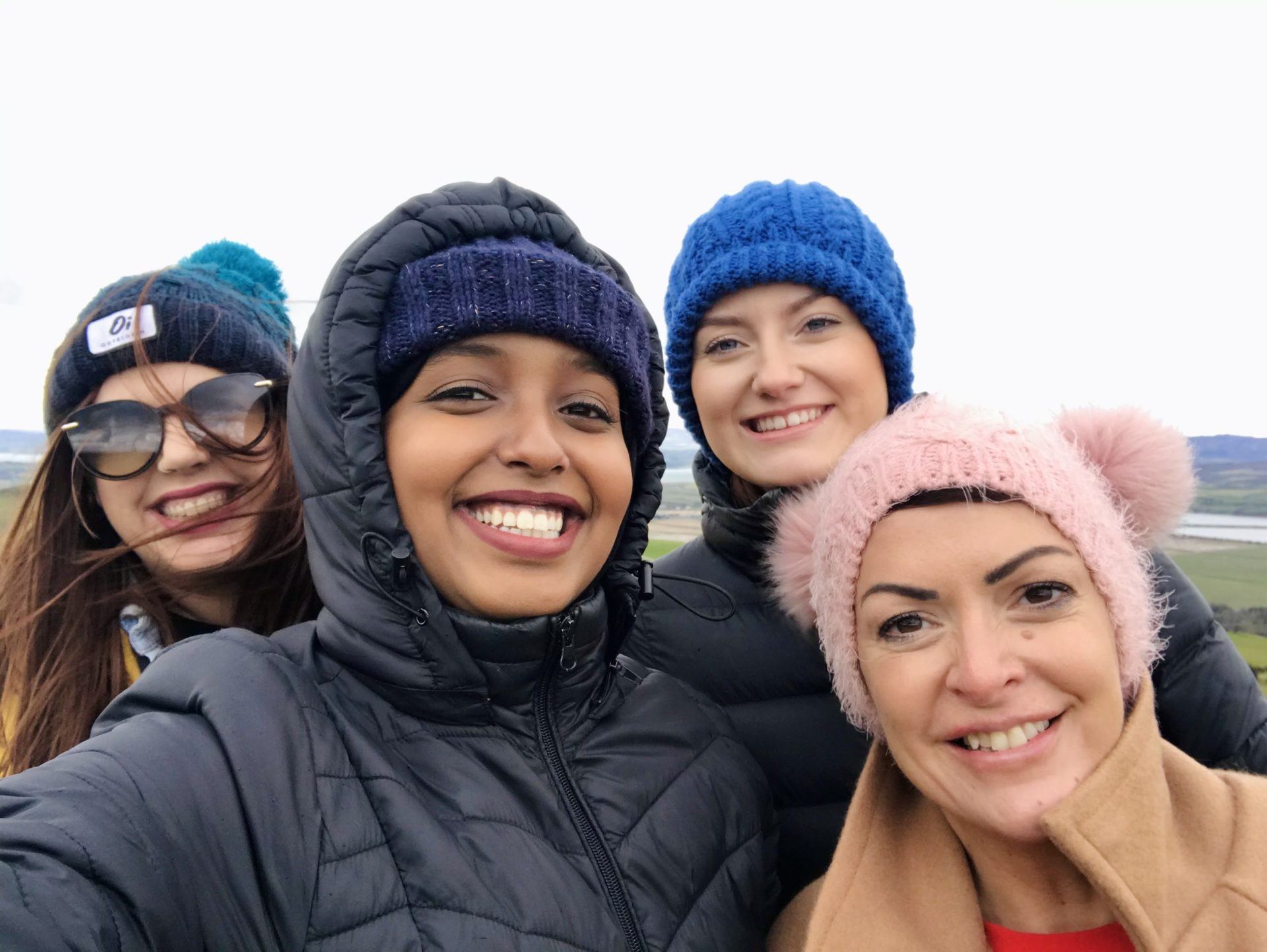 Yasmin Hirsi smiling with colleagues