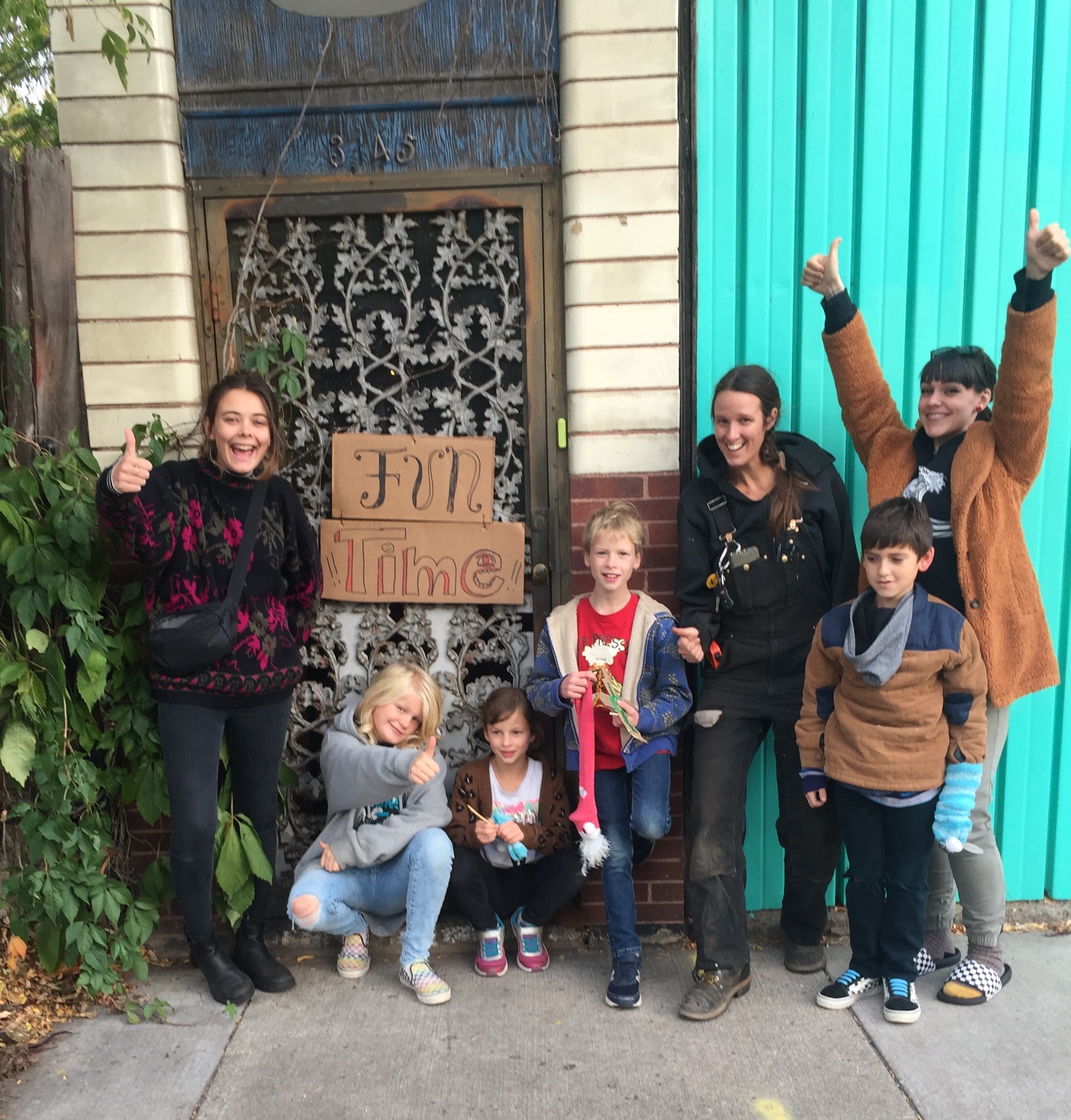 A group of young people collaborating outdoors during a community learning project