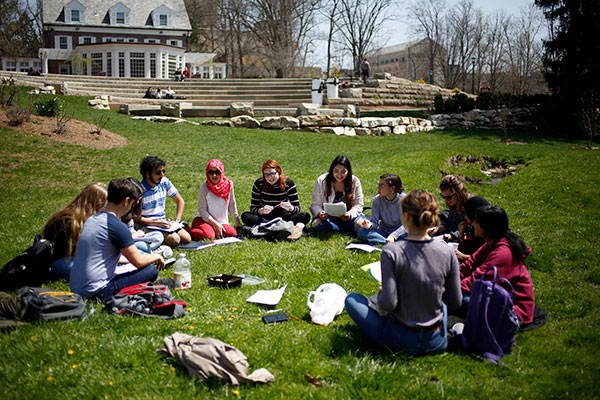 Students gathering in an international university courtyard