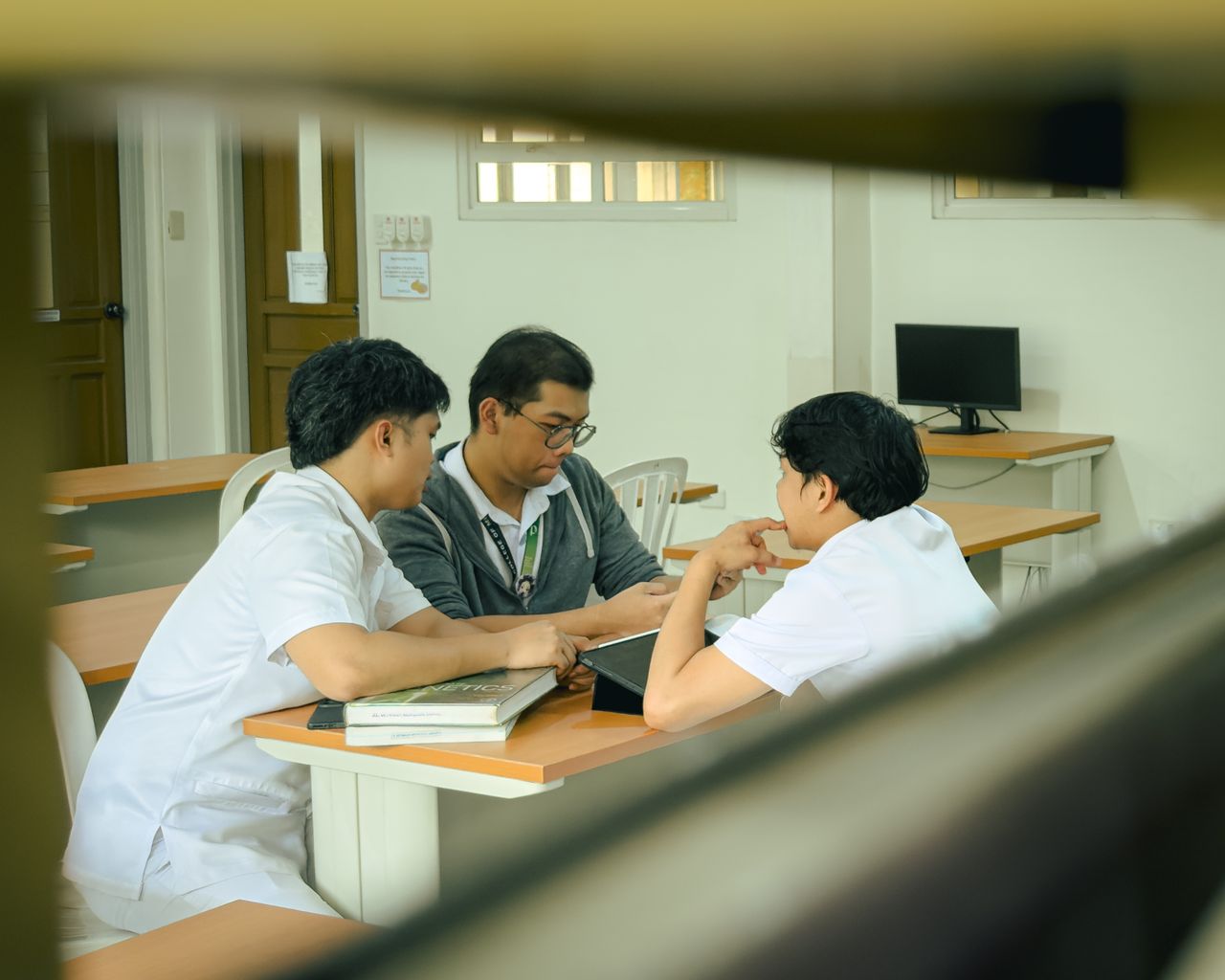 A diverse group of students collaborating around a table